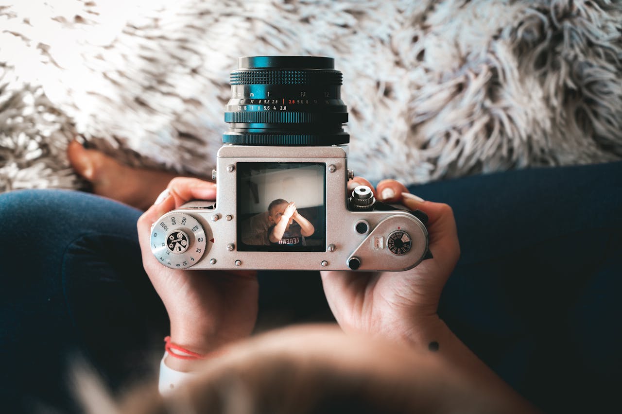 A vintage camera capturing a cherished moment of a child indoors on a cozy day.